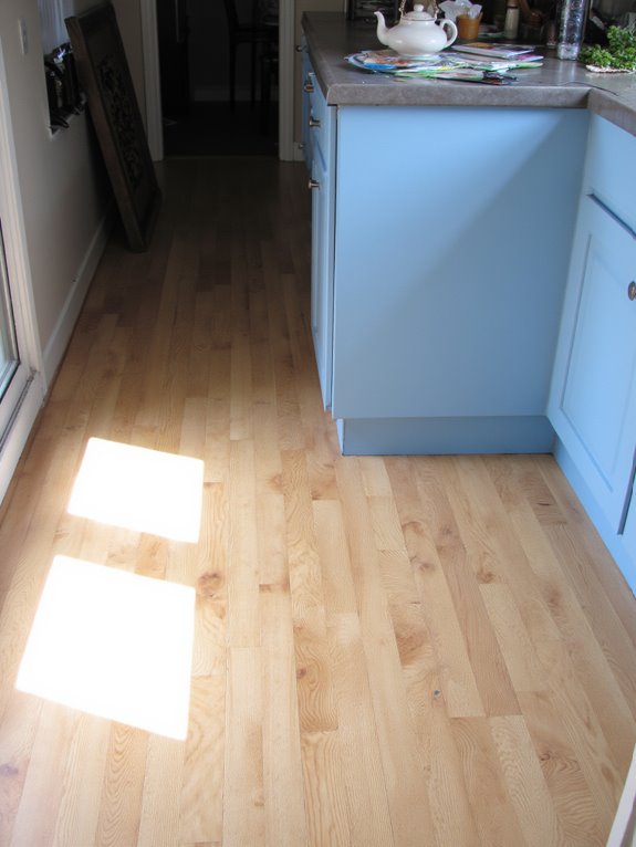 flooring enhances blue cabinets