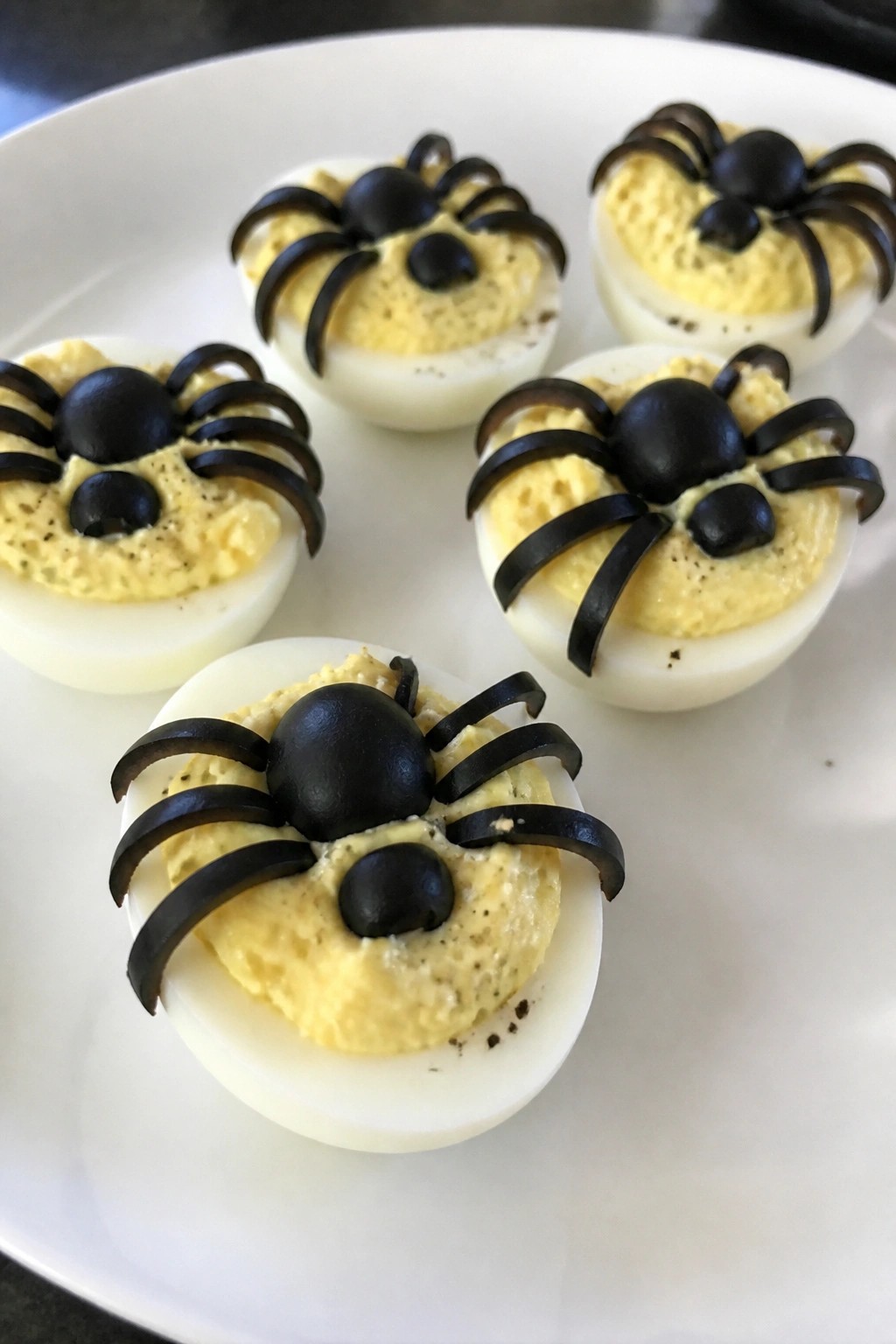 Deviled Egg Spiders with Cracked Pepper