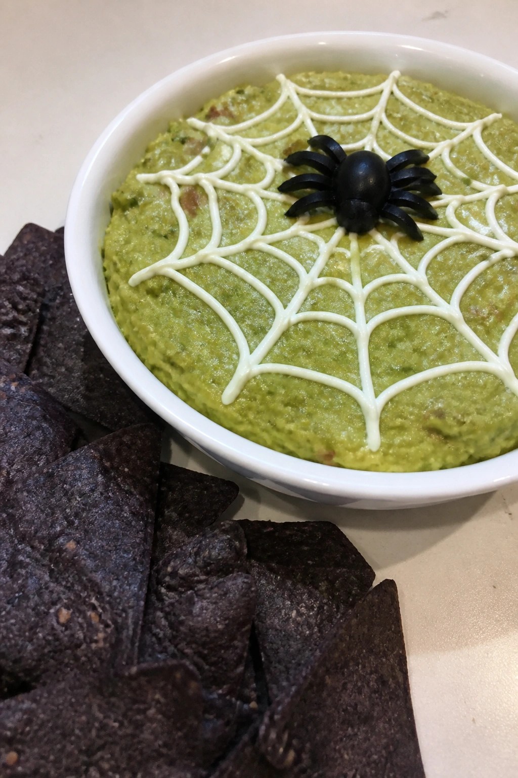 Spiderweb Guacamole with Black Tortilla Chips