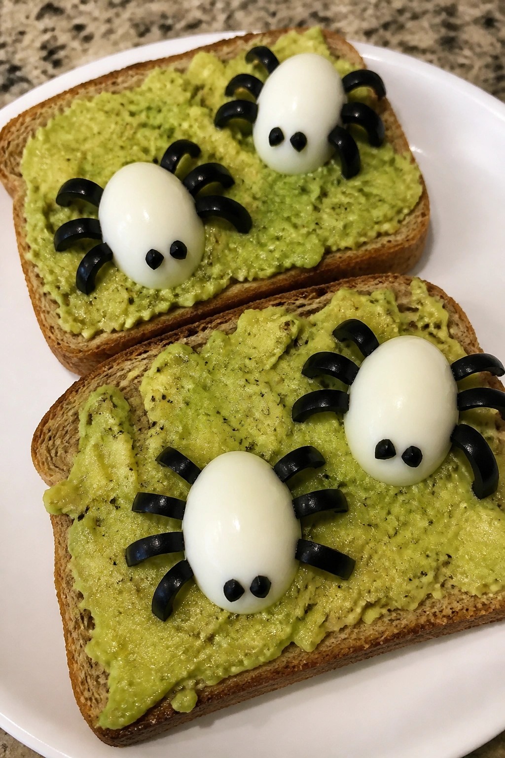 Creepy Crawly Avocado Toast with Egg Spiders