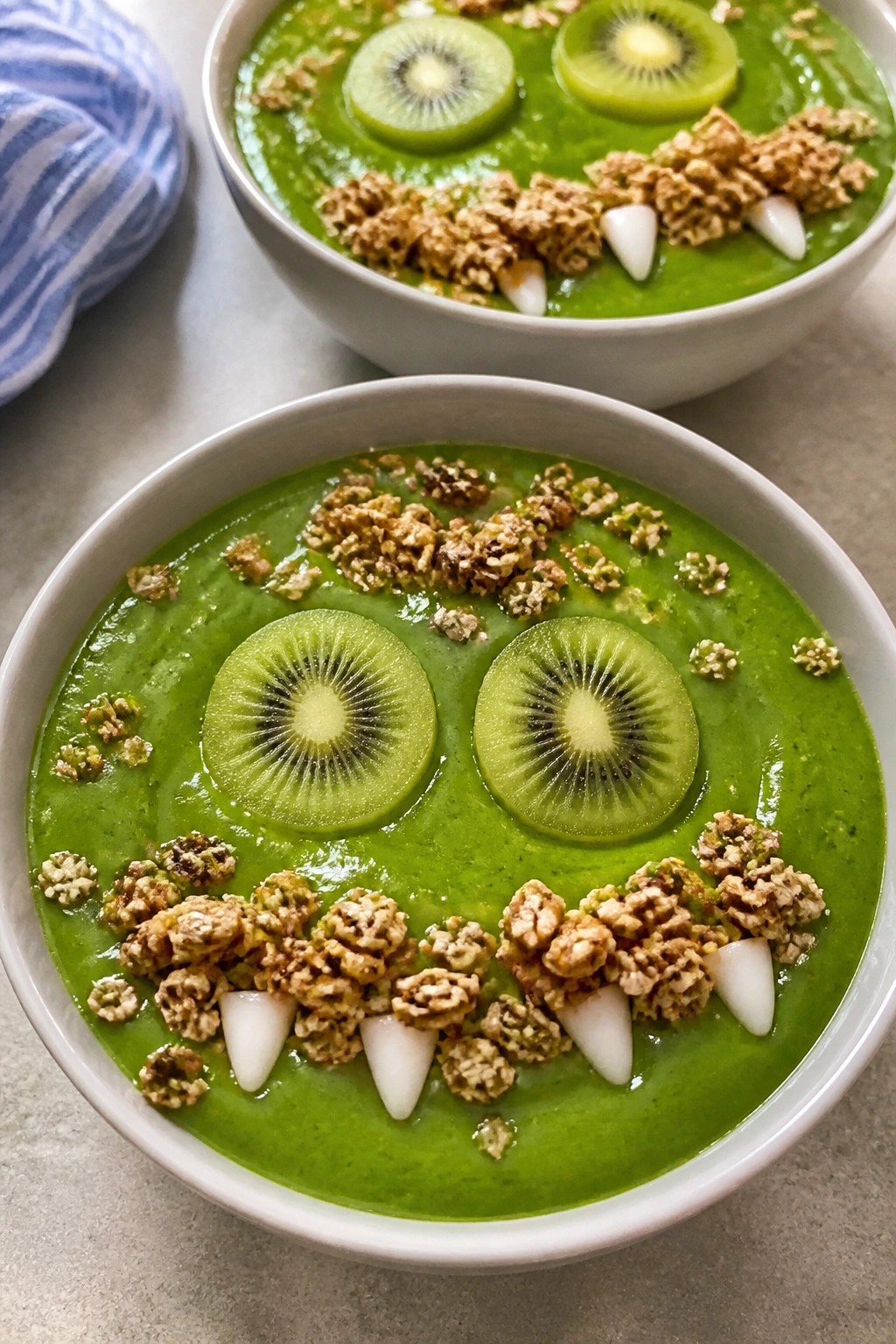 Monster Green Smoothie Bowls with Kiwi Eyes and Granola