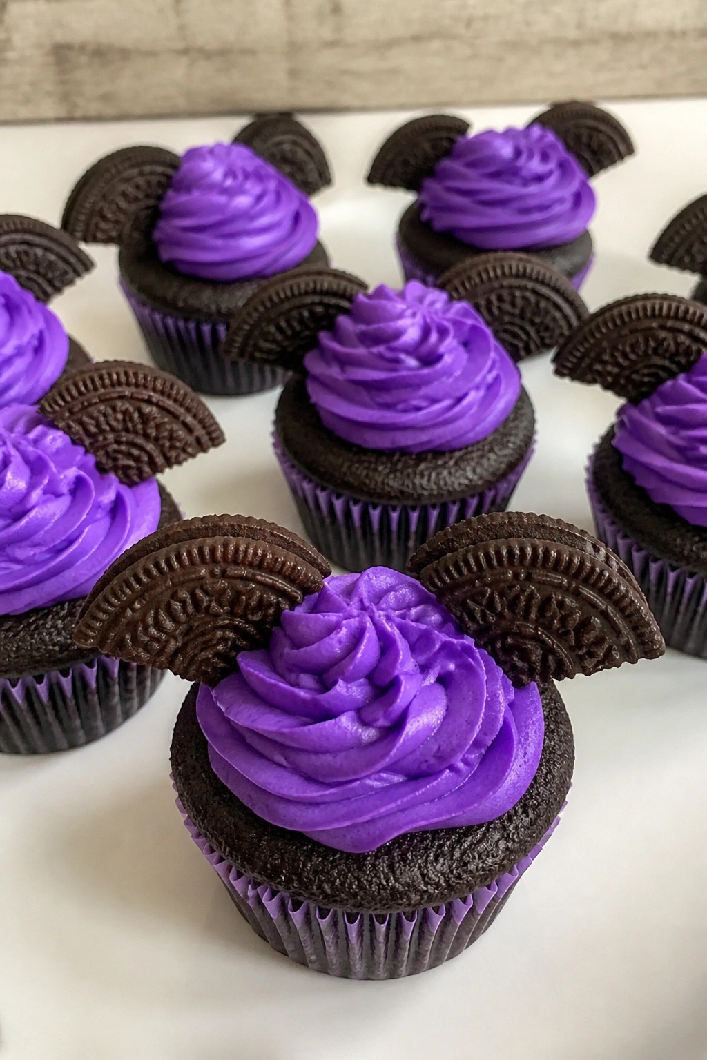 Bat Wing Dark Chocolate Cupcakes with Purple Buttercream