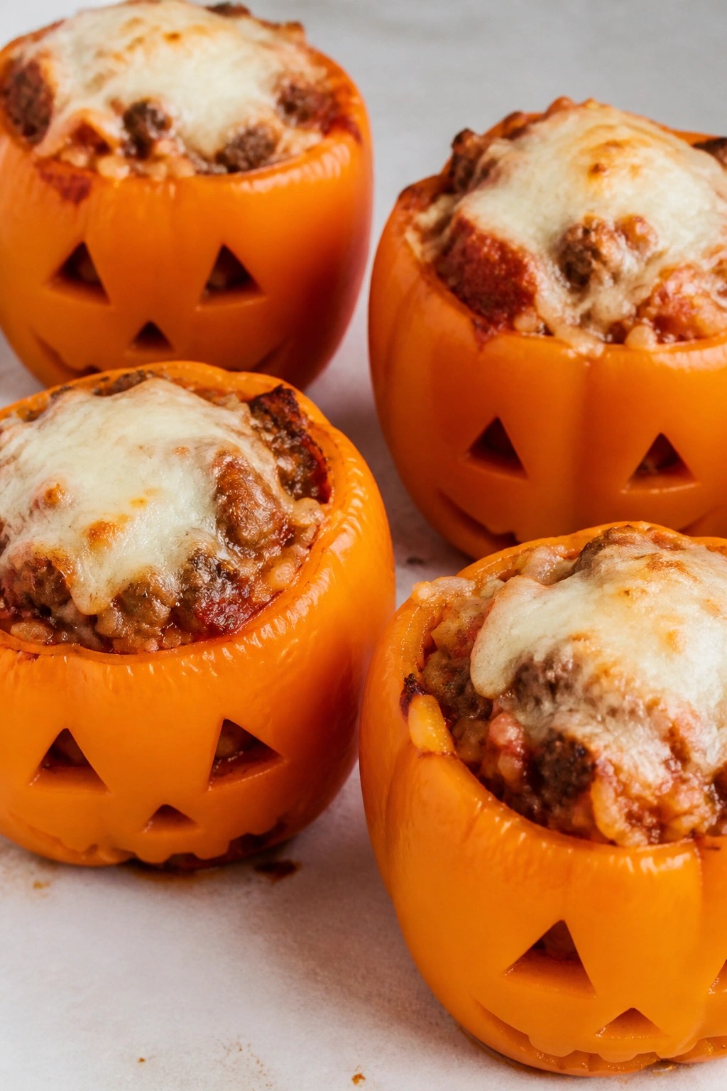 Jack-O'-Lantern Stuffed Bell Peppers with Beef and Rice