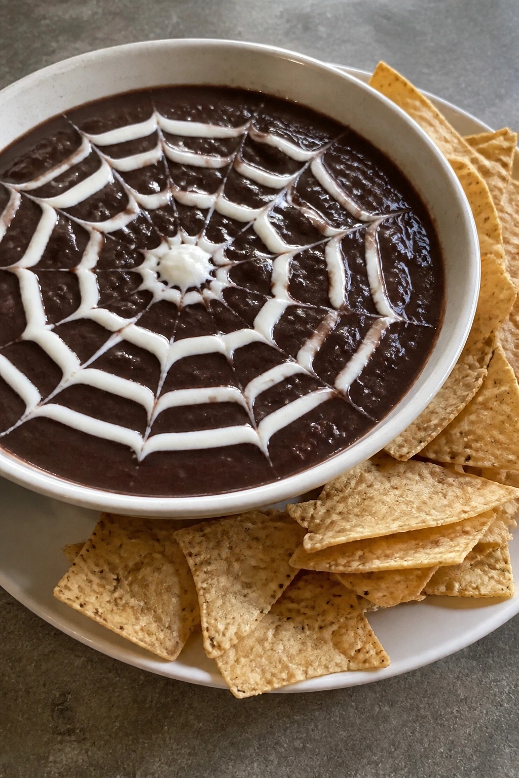 Spiderweb Black Bean Dip with Tortilla Chips