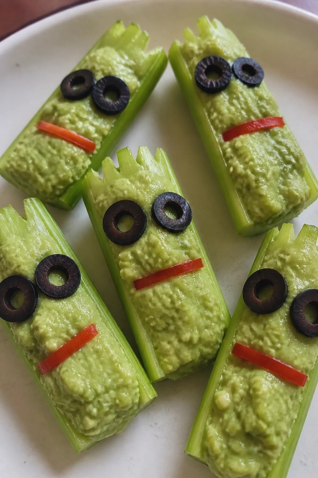 Frankenstein Celery Boats Topped with Avocado Mash