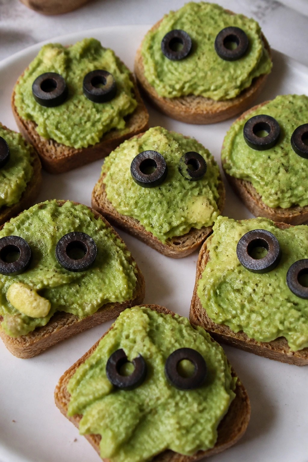 Monster Avocado Toast Bites with Olive Eyes