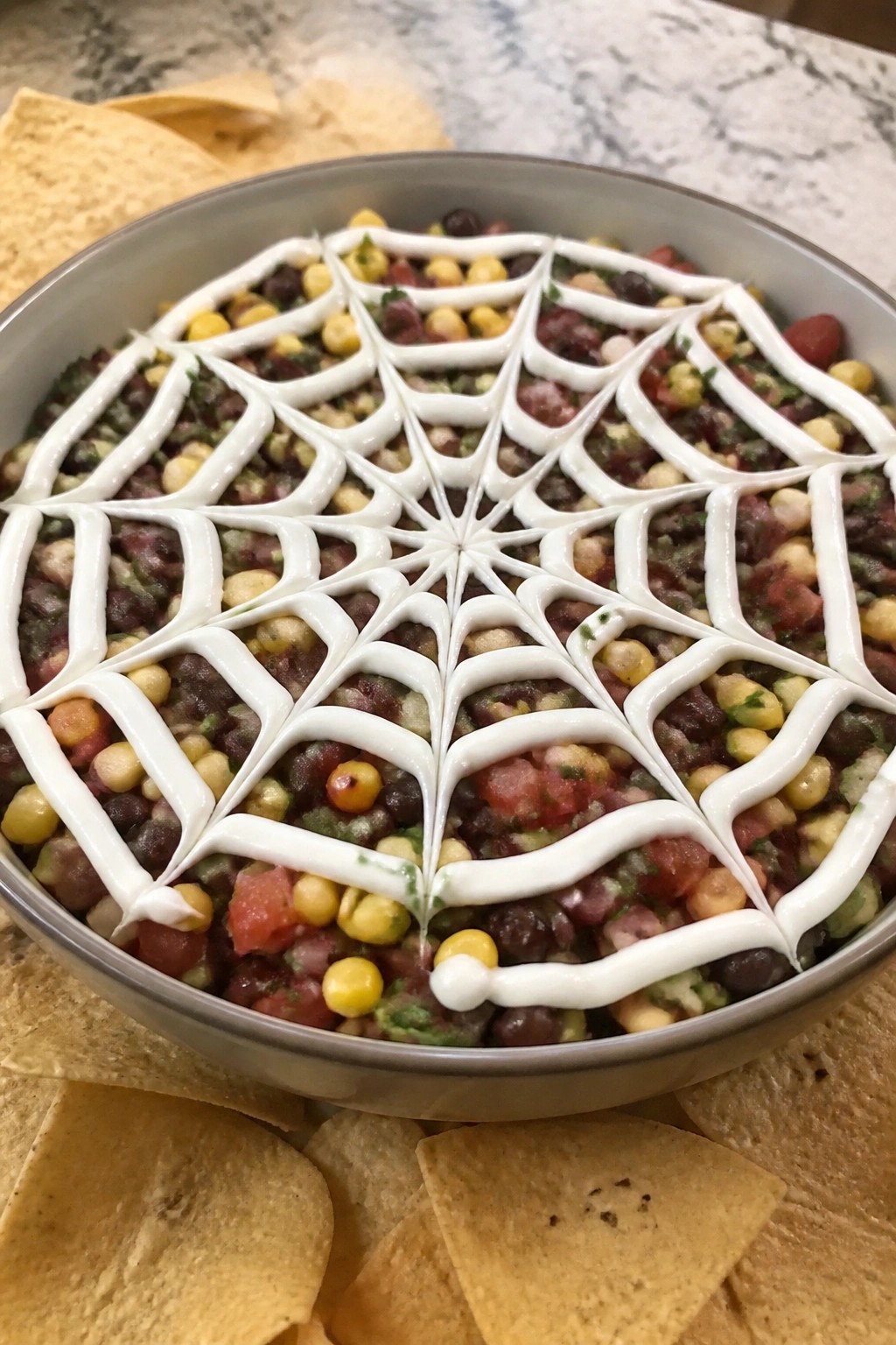 Spiderweb Black Bean and Corn Dip with Tortilla Chips