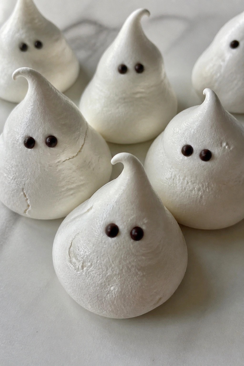 Ghostly Meringue Kisses with Chocolate Eyes