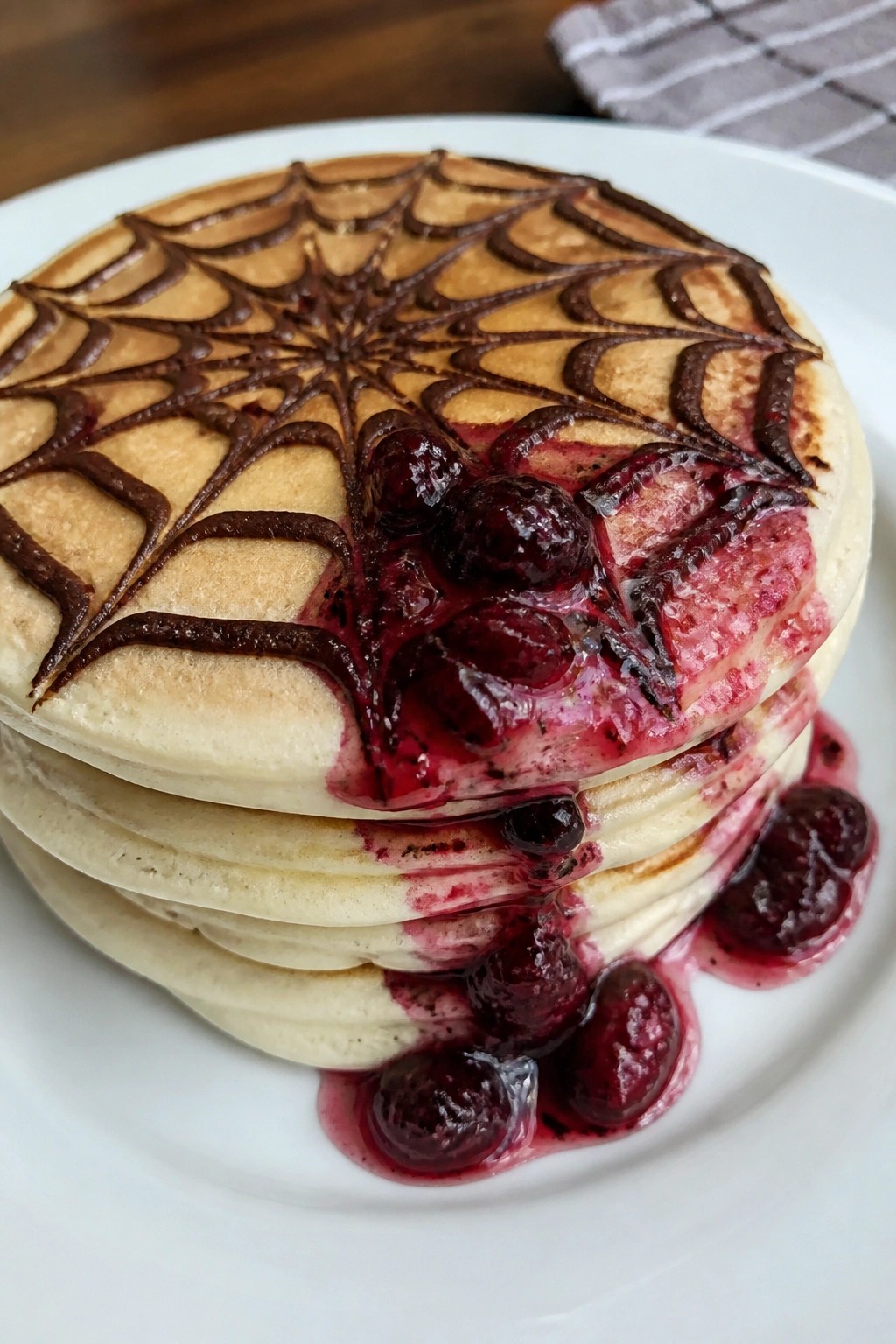 Spiderweb Pancakes with Berry Sauce