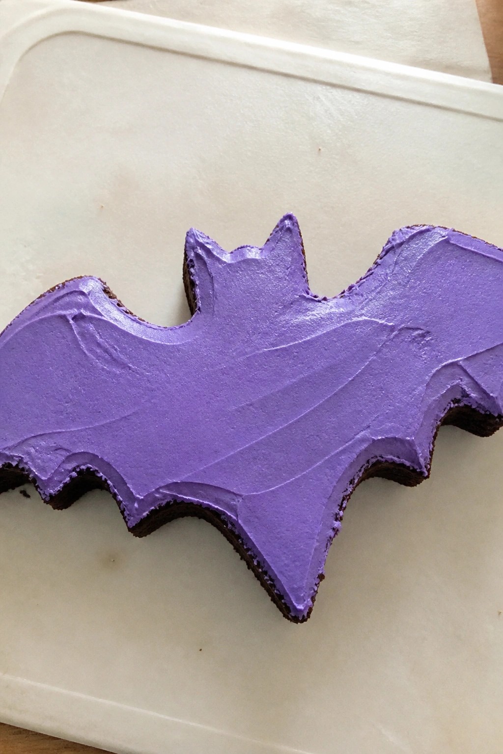Bat-Shaped Chocolate Cake with Purple Buttercream