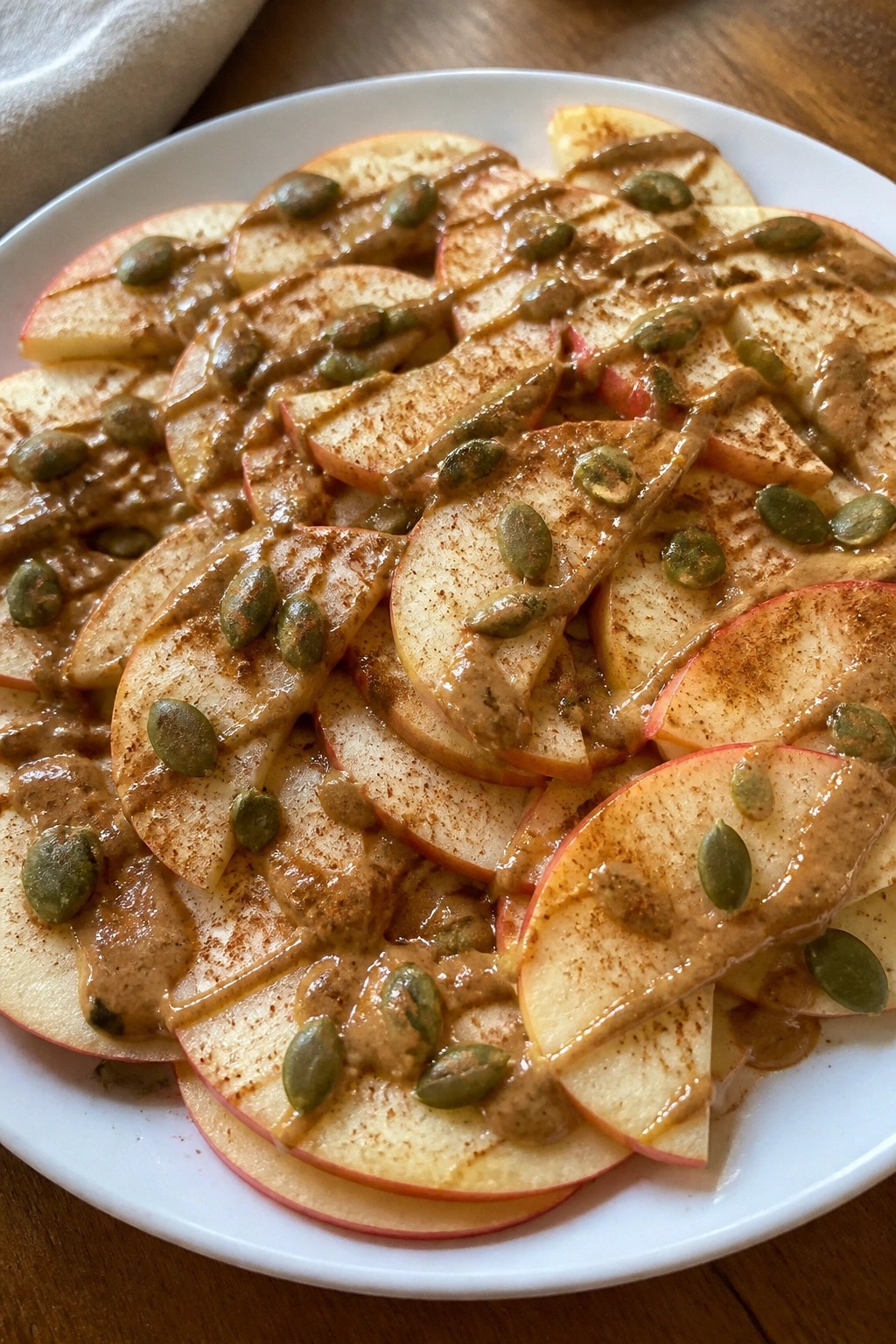Apple Nachos with Almond Butter, Cinnamon, and Pumpkin Seeds