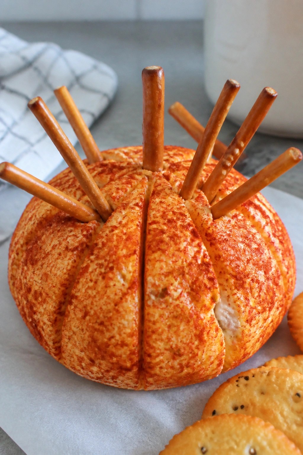 Pumpkin-Shaped Cheese Ball with Pretzel Broomsticks