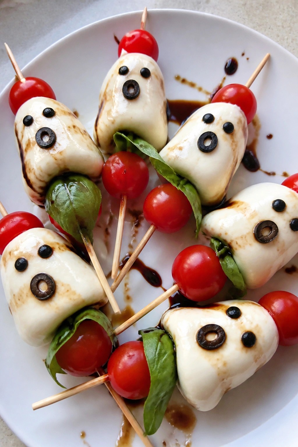Ghost-Shaped Caprese Skewers with Balsamic Drizzle