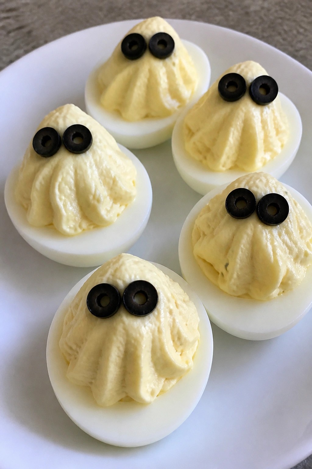 Ghostly Deviled Eggs with Olive Eyes