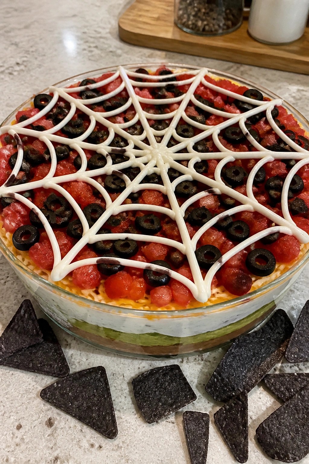 Spiderweb Seven-Layer Taco Dip with Black Tortilla Chips