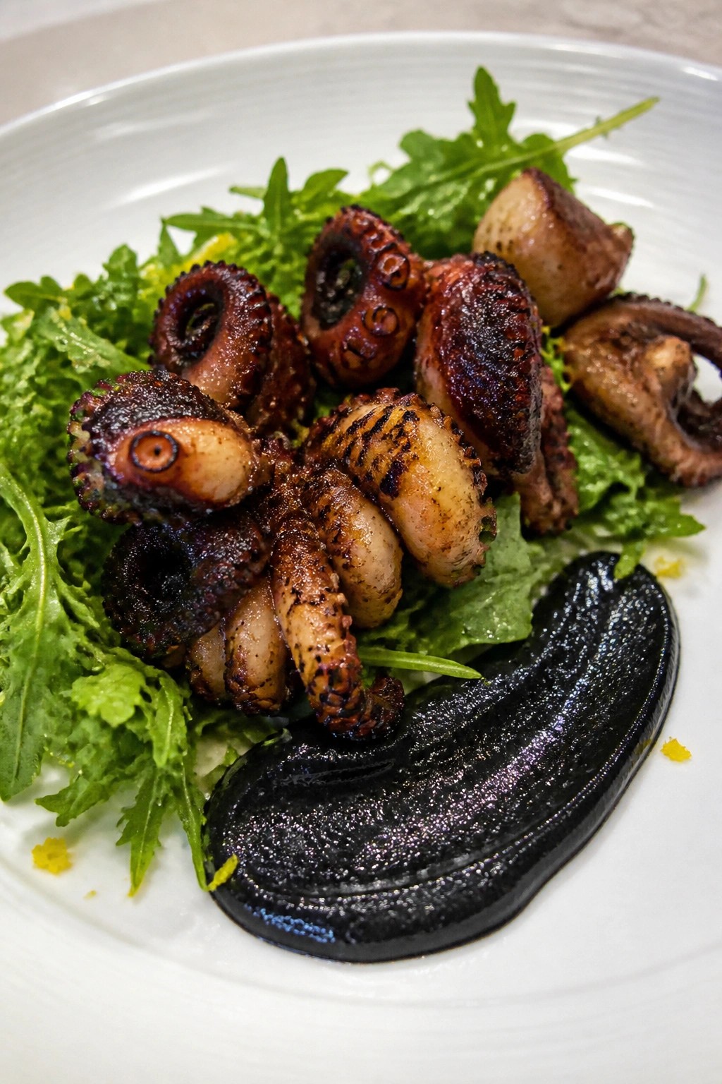 Charred Baby Octopus with Squid Ink Aioli and Lemon Arugula