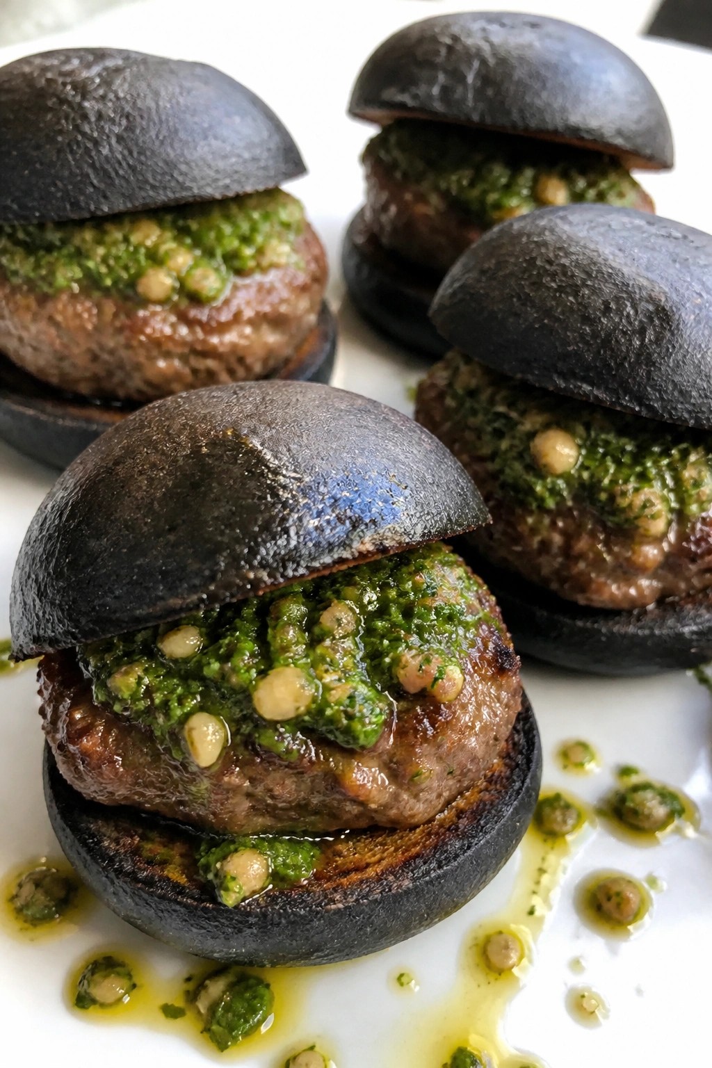 Mini Lamb Sliders on Charred Black Buns with Mint Pesto