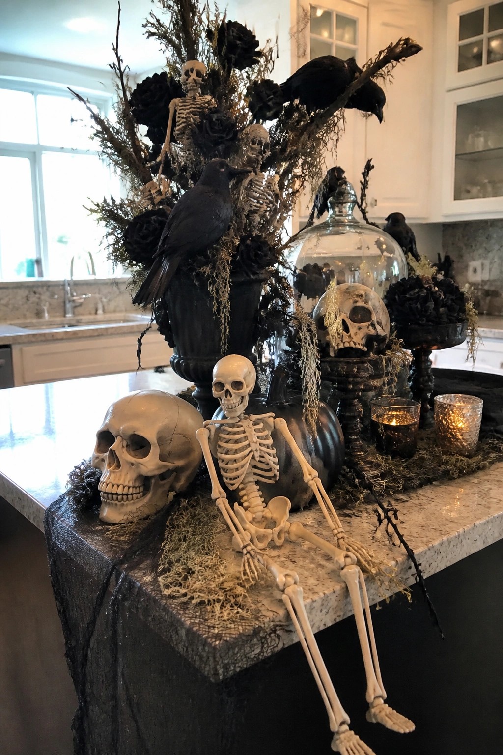 Skeleton, skulls, black crows, and dark flowers on kitchen countertop
