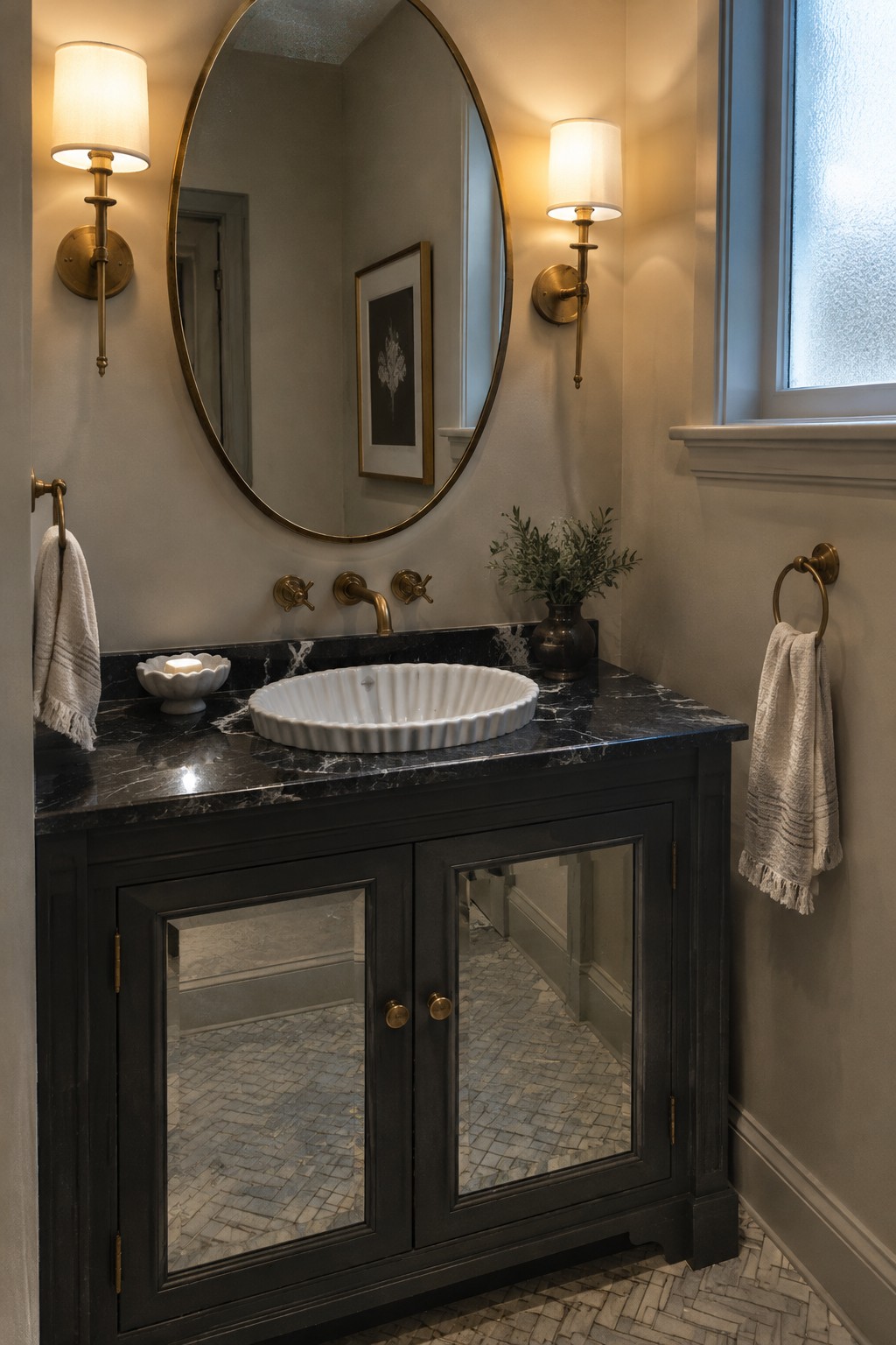 A dark bathroom vanity with mirrored cabinet doors, a black marble countertop, and a white vessel sink.